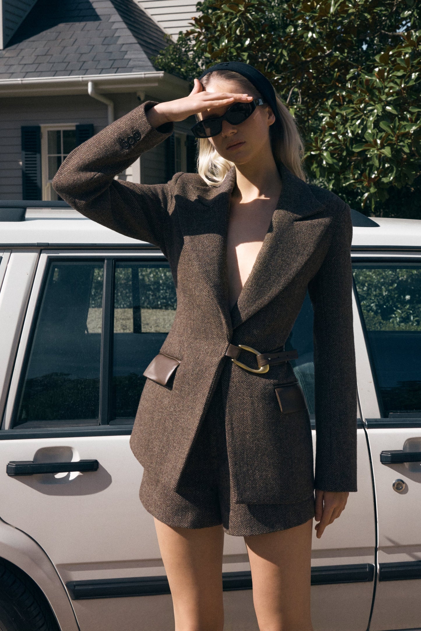 Image of woman in brown tweed blazer