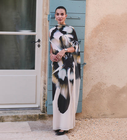 Image of woman in floral print dress.
