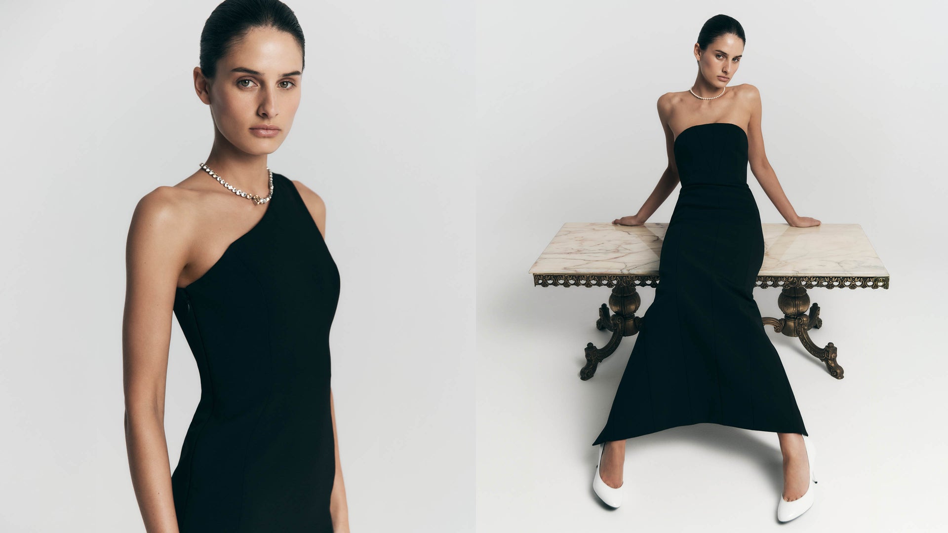 Woman wearing a black one-shoulder and strapless dress against a white background.