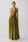 Woman wearing a olive green halter maxi dress.