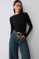 Woman wearing black long sleeve.