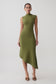 Woman wearing a green pleated knit dress.