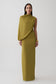 Woman wearing a green gather sleeve maxi dress.
