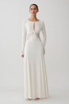 Woman wearing a white lace slinky maxi dress.