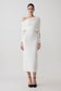 Woman wearing a white modal one shoulder midi dress.