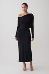 Woman wearing a black modal one shoulder midi dress.