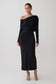 Woman wearing a black modal one shoulder midi dress.