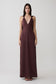 Woman wearing a brown draped shoulders satin maxi dress.