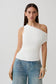 Woman wearing a white short sleeve draped hardware top.