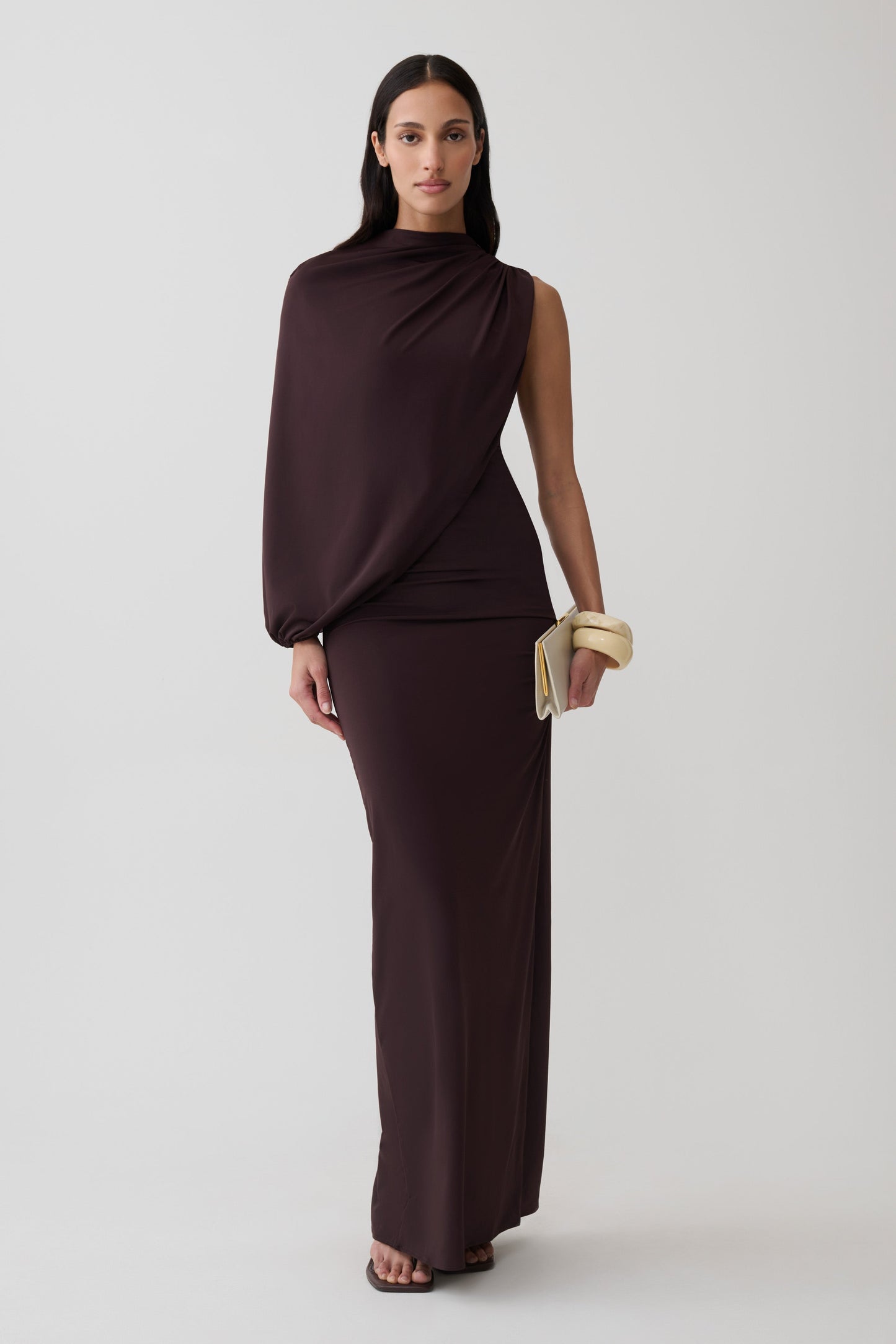 Woman wearing brown gather sleeve maxi dress.