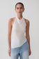 Woman wearing a white relaxed sheer halter top.