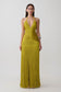 Woman wearing a green fringe maxi dress.