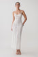 Woman wearing a white lace and mesh midi dress.