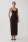 Woman wearing a dark brown lace and mesh midi dress.