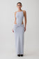 Woman wearing a light blue sleeveless maxi dress.