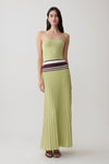 Woman wearing a ligth green strapless contrast knit maxi dress.