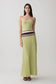 Woman wearing a ligth green strapless contrast knit maxi dress.