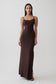 Woman wearing brown peached jersey maxi dress.