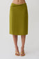 Woman wearing a green chiffon midi skirt.