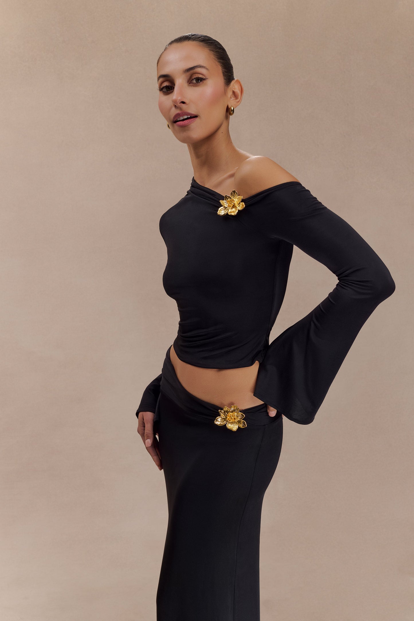 Ainsley Asymmetrical Long Sleeve Top With Floral Hardware - Black