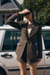 Image of woman in brown tweed blazer
