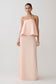 Woman wearing a strapless blush pink gown.