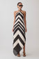 Woman wearing a black and white chevron patterned dress.