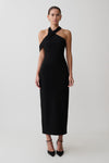 Woman wearing black crossover neck dress.