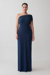 Woman wearing a navy one-shoulder gown.