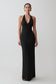 Woman wearing a black halter neck gown on a white background