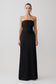 Woman wearing a black strapless gown on a white background