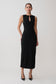 Woman wearing a black sleeveless dress on a white background
