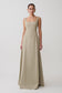 Woman wearing a beige sleeveless gown on a white background