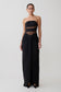 Black strapless gown with sheer panels on a white background