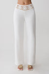 White knit pants with crochet waistband detailing.