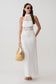 Woman wearing a knit and crochet maxi dress.