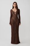 Woman wearing a brown lurex crochet long-sleeve dress.