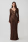 Woman wearing a brown lurex crochet long-sleeve dress.