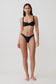 Woman wearing a black bikini set.