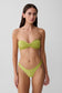 Woman wearing a green bikini set.
