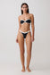 Woman wearing a black and white bikini set.