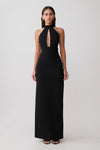 Woman wearing black stretch crepe maxi dress.