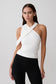 Woman wearing white crossover crepe halter top.