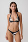 Woman wearing a black and white floral print bikini set.