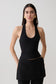 Woman wearing a black ribbed tank.
