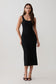 Woman wearing a black stretch crepe mini dress.
