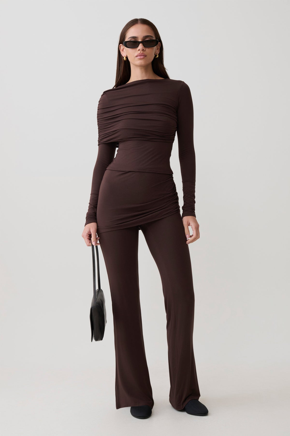 Woman wearing a brown modal straight leg overlay pant with matching top.