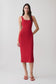 Woman wearing a red crepe midi dress.