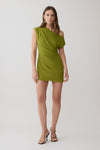 Woman wearing a green asymmetric neckline mini dress.