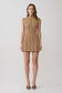 Woman wearing a brown and orange striped sleeveless mini dress.